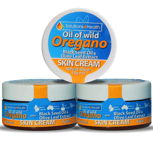 three tubs of Oil of Wild Oregano with Black Seed Oil and Olive Leaf Extract Skin Cream tub on white background