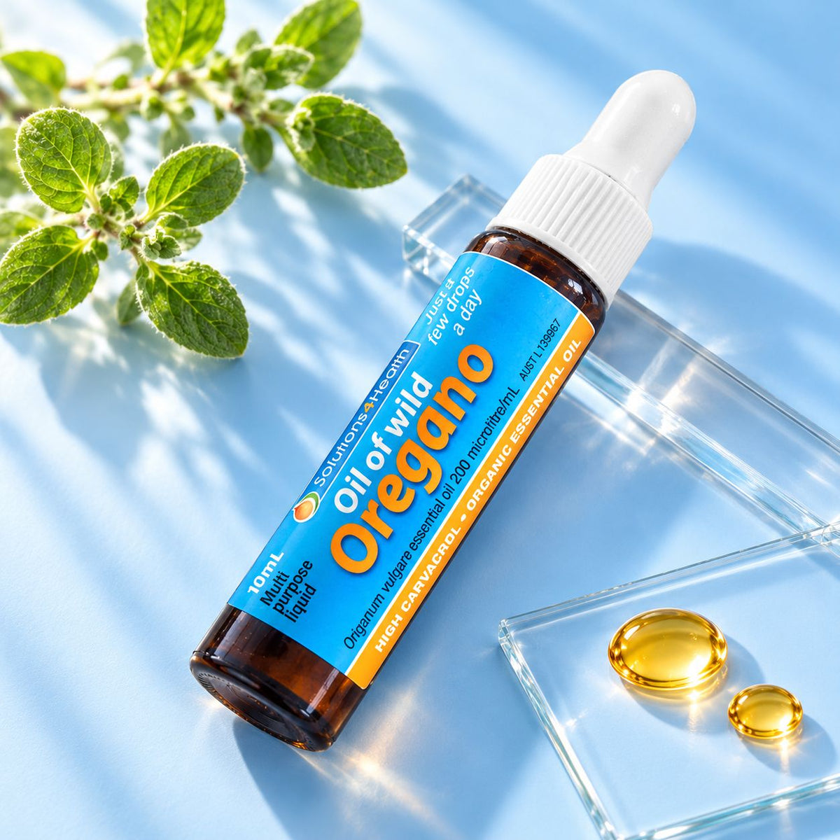 Solutions4Health Oil of Wild Oregano 10ml travel bottle with fresh oregano and golden oil droplets on a light blue background.