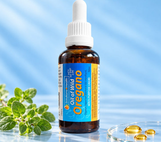 Solutions4Health Oil of Wild Oregano 50ml bottle with fresh oregano and golden oil droplets against a light blue background.